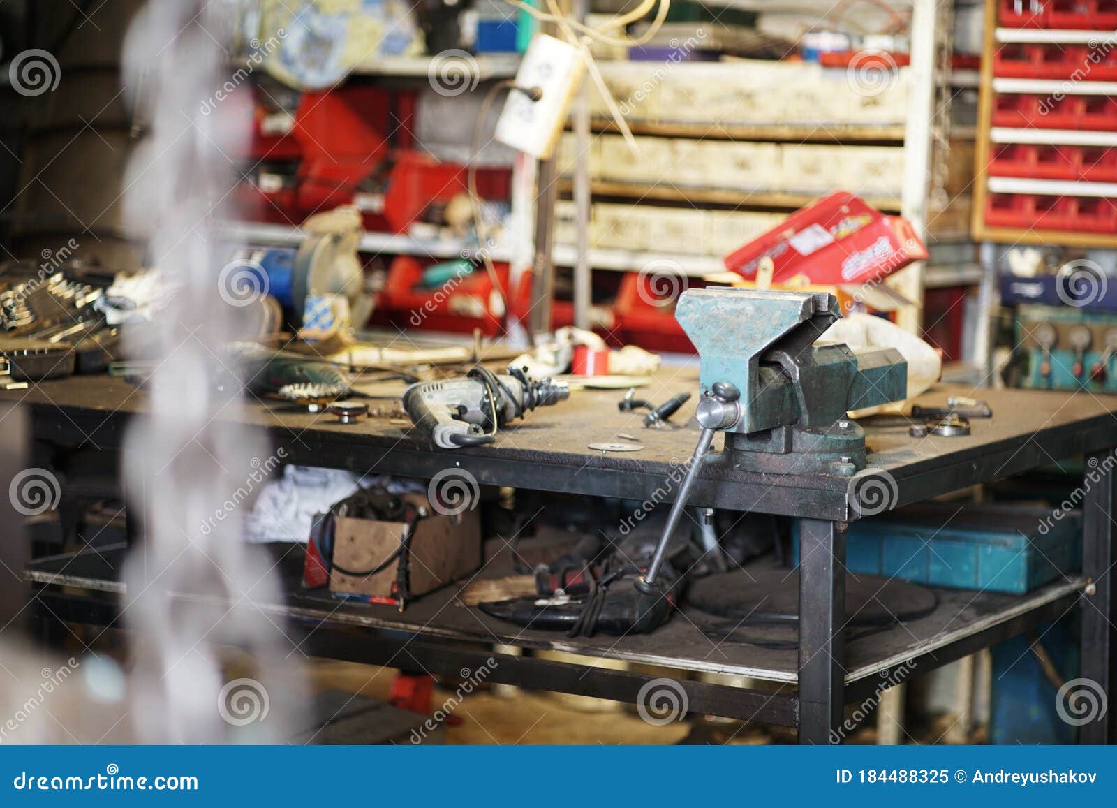 workbench, vise. car service. the focus is on the disks.